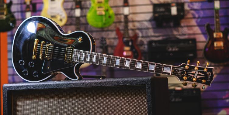 Gibson Les Paul Custom LPC-EBGH1E electric guitar with an ebony fingerboard and gold hardware.