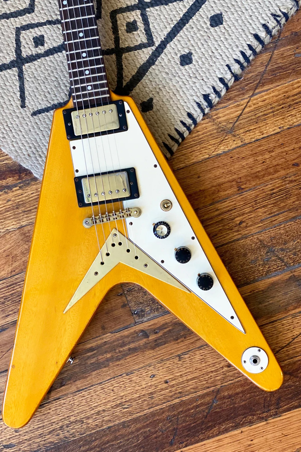 Epiphone 1958 Korina Flying V electric guitar with a vintage-inspired design and Korina wood body.
