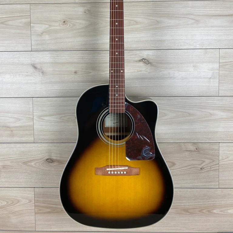 This acoustic-electric guitar features a select spruce top with select mahogany back and sides.